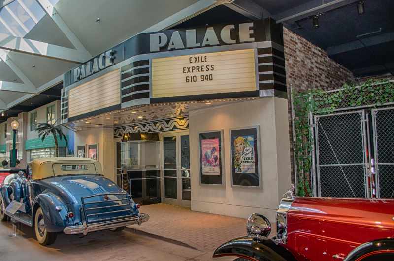 old cars in front of theater